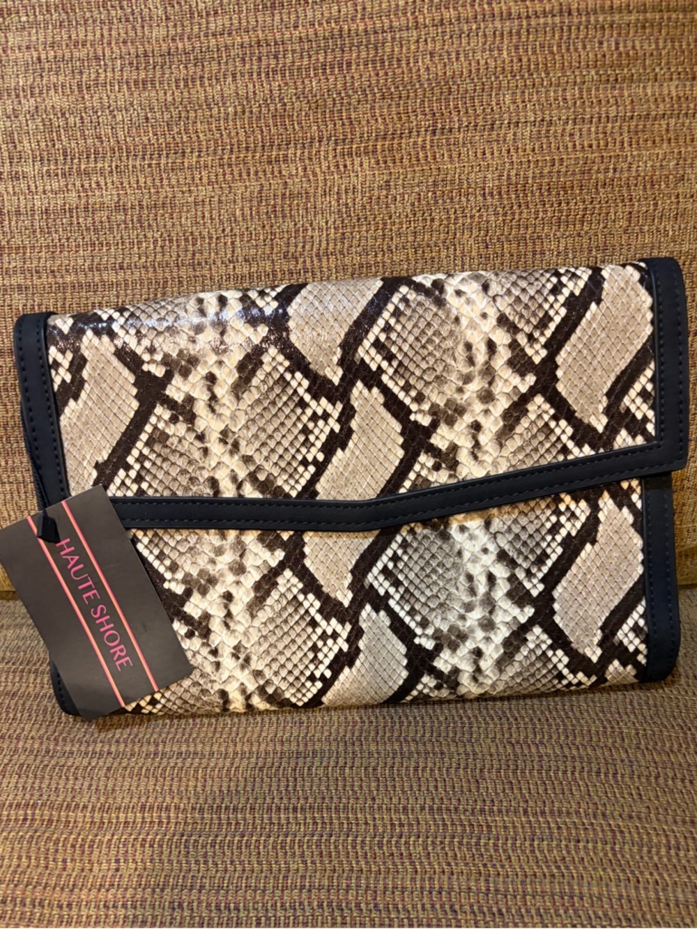 HAUTE SHORE Beth Fold-Over Clutch in Natural Python Print with Black Trim